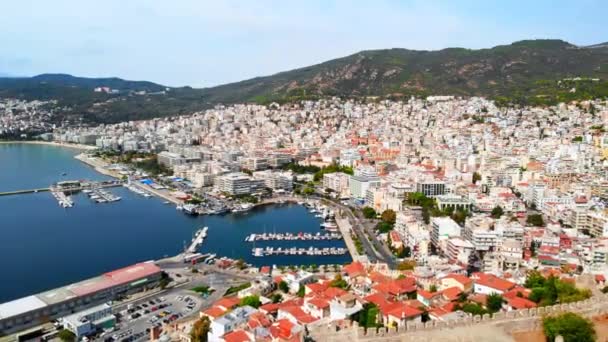 Aerial view of Kavala, a lot of buildings, Aegean sea coast, sea port, ancient fort, green hills in the distance, Greece — Stock Video