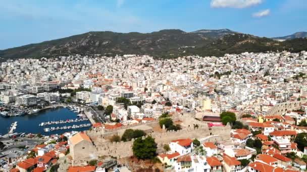 Aerial view of Kavala, a lot of buildings, Aegean sea coast, sea port, ancient fort, green hills in the distance, Greece — Stock Video