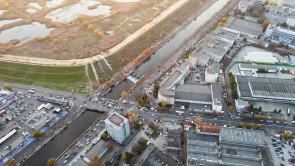 Streetscape of Bucharest, lakes in a park and crossroads near the water channel with lots of moving cars. View from the drone, Romania — Stock Video