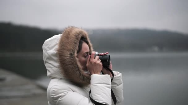 Woman White Winter Coat Taking Photos Shooting Video Vintage Camera — Stock Video