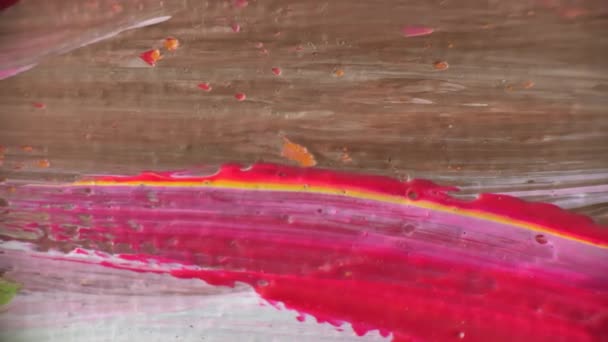 Primer plano de una pintura con textura de colores rojo y marrón — Vídeos de Stock