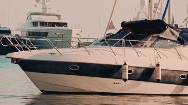Cannes, France - November 8, 2025: Side view of a yacht moving slowly through a marina