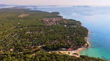 Aerial drone view of the vast pine forest stretching along the coast near Biograd na Moru, Croatia
