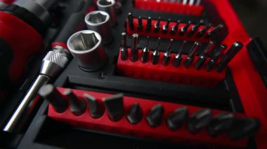 Close up shot of a professional tool kit with screwdriver bits and sockets neatly organized