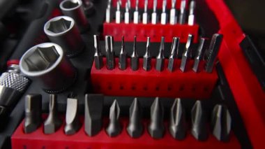 Close up shot of a professional tool kit with screwdriver bits and sockets neatly organized