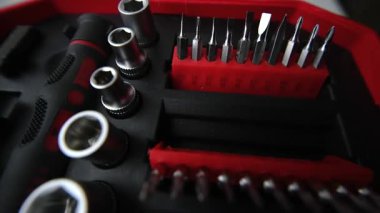Close up shot of a professional tool kit with screwdriver bits and sockets neatly organized