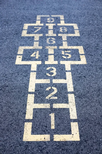 Hopscotch game on asphalt in the school yard playground