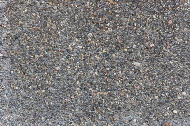 Gri taşlı arka plan. Duvarda küçük taşlar var..