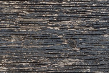 Eski ahşap zemin, yüzeyi siyah boyayla kaplanmış. Soyut doku
