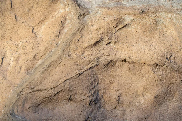 黒褐色の古い石の抽象的な背景のクローズアップ — ストック写真