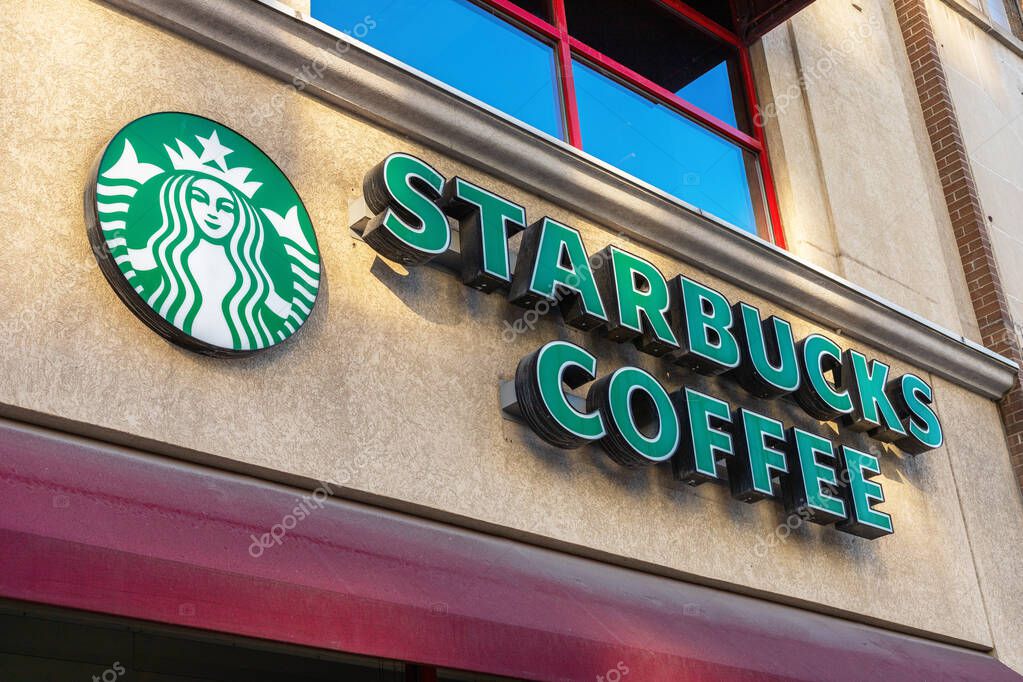 Ottawa, Canada - May 23, 2021: Starbucks coffee sign on the building. Popular cafe