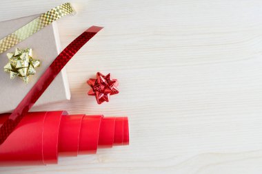Christmas gift box wrapping concept on wooden background with copy space. Holiday preparations