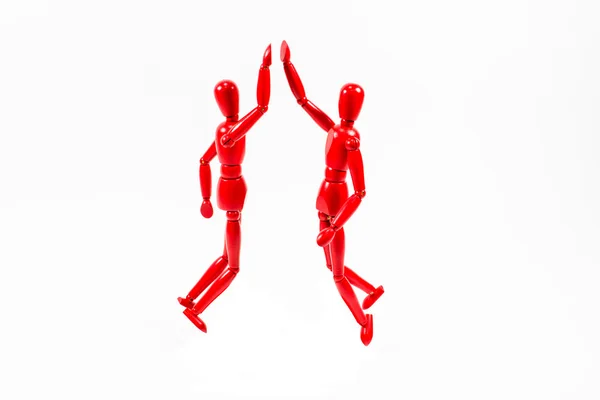 Two man jumping up giving high five