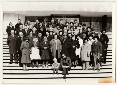 Vintage photo shows group of people stand on stairs. clipart