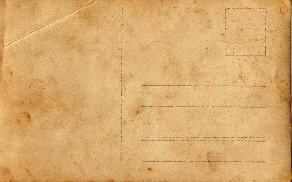 Baksidan av en vintage vykort. Rika fläcken och papper detaljer. Kan användas som bakgrund. — Stockfoto