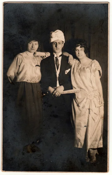 Vintage photo shows actor and actresses on theatre stage. Black & white antuque photography.