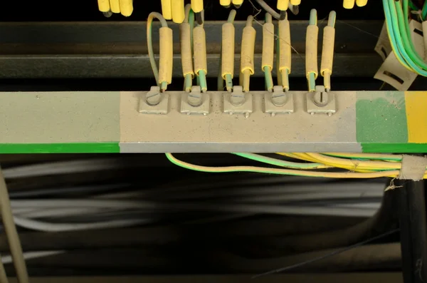 Closeup of wires. Grounding conductor, earth lead, ground lead with dust (neutral conductors).