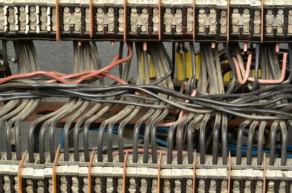 Connection of electrical wires (phase conductors) in electrical distribution board. — Stock Photo, Image