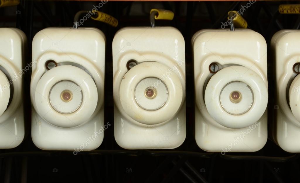 White vintage electrical fuses. Old ceramic fuses in switchboard. — Stock Photo © RomanNerud