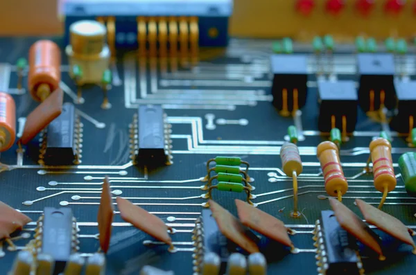 Condensers, relays assembly on the circuit board. Macro image. Shallow DOF. — Stock Photo, Image