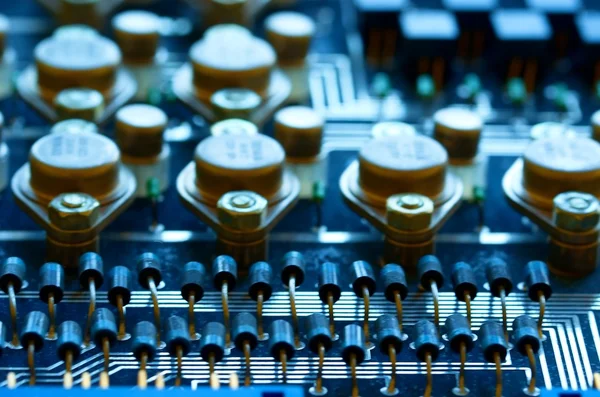 Condensers, relays assembly on the circuit board. Macro image. Shallow DOF. — Stock Photo, Image