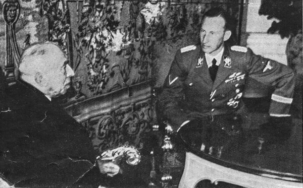 PRAGUE, PROTECTORATE OF BOHEMIA AND MORAVIA - SEPTEMBER 30, 1941: Reinhard Heydrich, Deputy Reich Protector of the Protectorate of Bohemia and Moravia, right, meets Emil Hacha, State President, at the Prague Castle in Prague, Protectorate of Bohemia 
