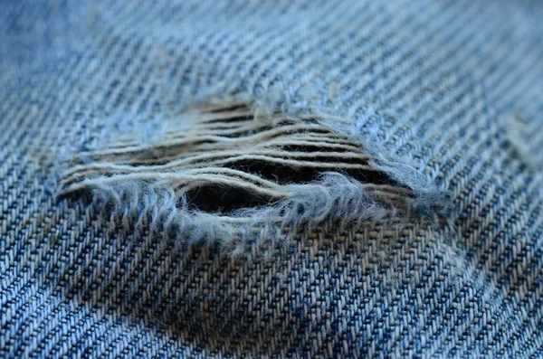 Frayed and torn denim structure — Stock Photo, Image