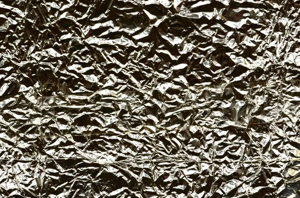 Superficie de papel de aluminio dorado con textura de papel de aluminio  dorado brillante arrugado para fondos fondo de patrón sin costura