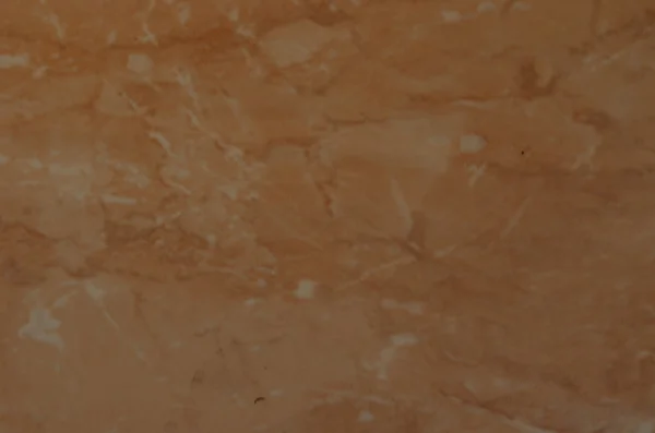 Размытая коричневая текстура плитки с мелкими пятнами — стоковое фото
