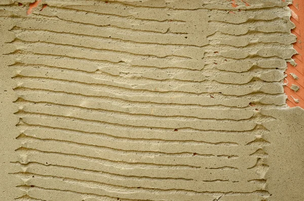 Lado inverso gravado de azulejo pequeno com reboco seco — Fotografia de Stock