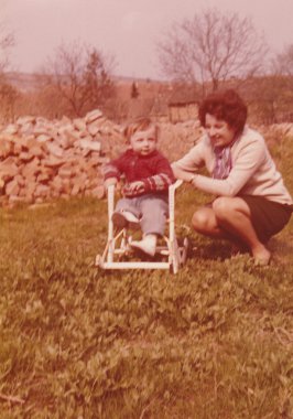 A small boy with mum - retro photo.  Early seventies.