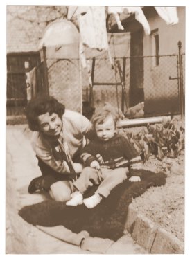 A small boy with mum - retro photo.  Early seventies.