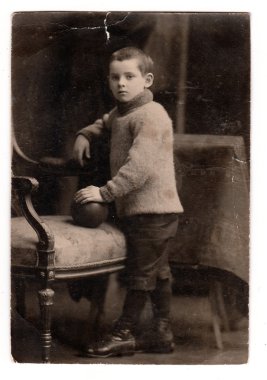 A small boy vintage photo. Photo was taken in photo studio. A small boy retro photo. The pre-twenties of last century