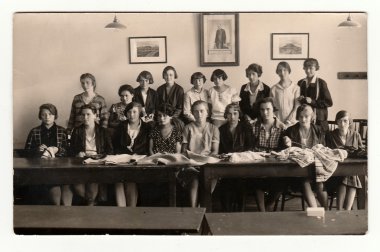 A group of girls in classroom (1933). Vintage photo.
