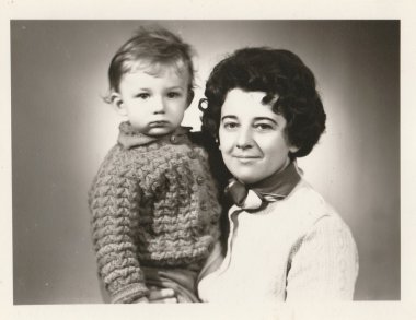 Retro photo of mother and her son.  Portrait photo was taken in photo studio. Early seventies