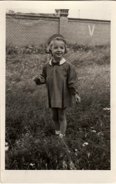 Vintage photo of the small girl.  Photo was taken in Hodonin (the Czech Republic). Early forties
