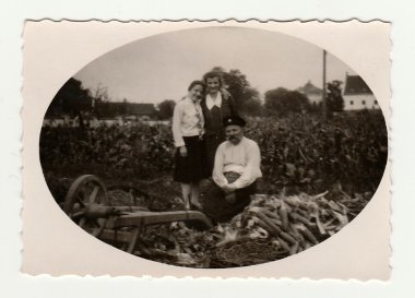 Family in corn field. Vintage photo was taken in the Czech Republic. The thirties