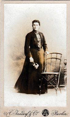 Vintage photo of woman. Photo was taken in photo studio in Berlin
