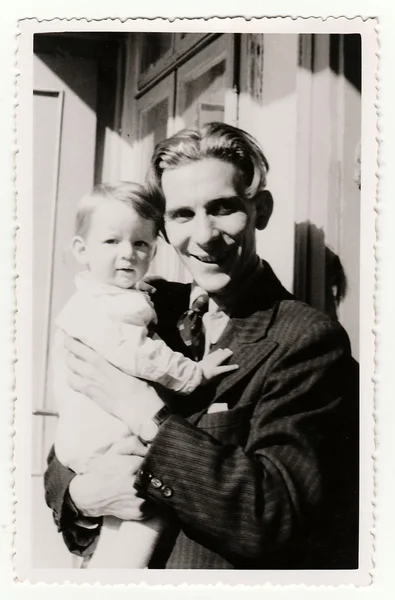 A small girl with her uncle. Vintage photo was taken in Hodonin (the Czech Republic). Early forties. — 图库照片