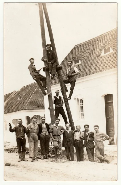 Vintage photo of electricians. Building of power lines — Stock Fotó