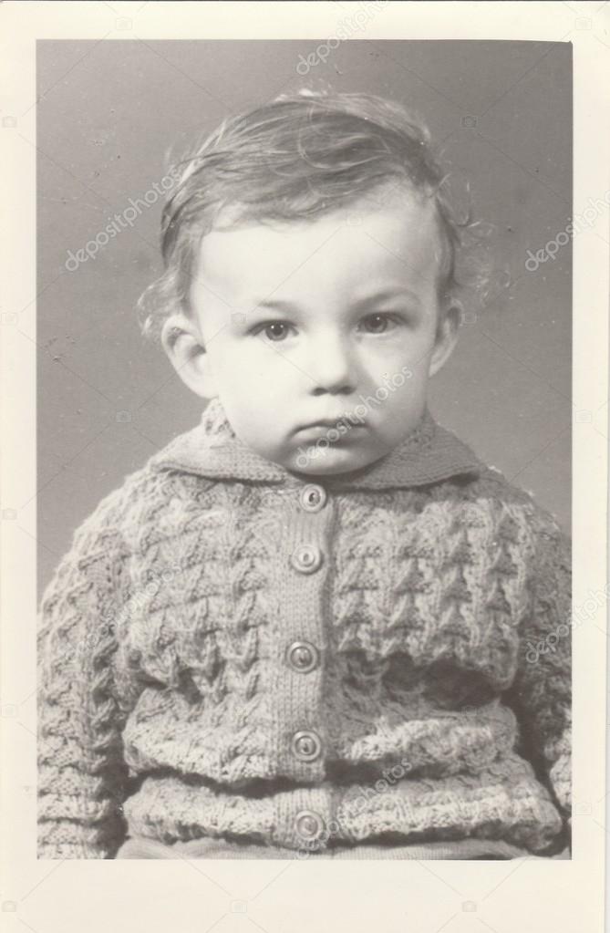 A small boy retro photo.  Portrait photo was taken in photo studio. Early seventies