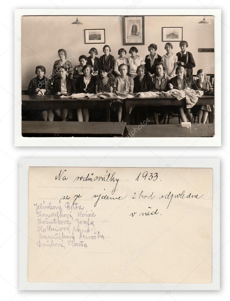 Front and back of photo. A group of girls in classroom (1933). Vintage photo