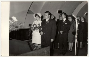 A vintage photo shows wedding ceremony, circa 1970.