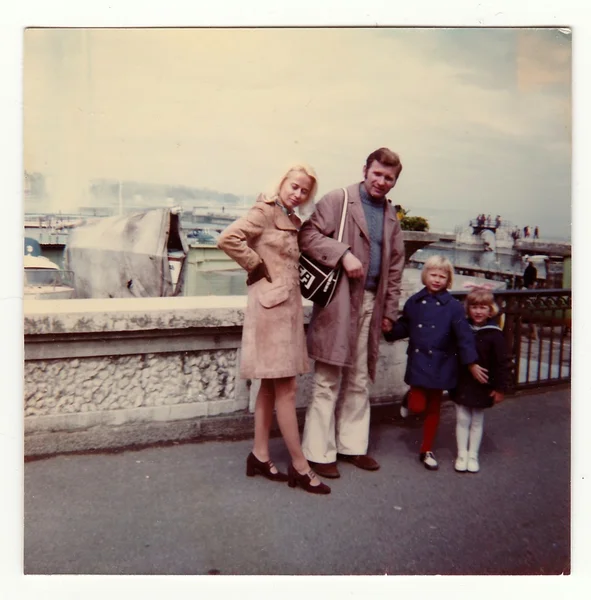 Vintage photo shows family on vacation, circa 1970s.