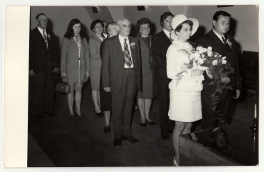 A vintage photo shows wedding ceremony, circa 1970.