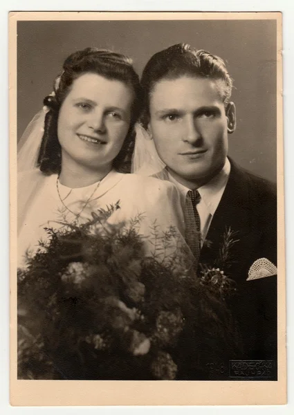 A vintage photo shows wedding  portrait of newly-weds, circa 1955.