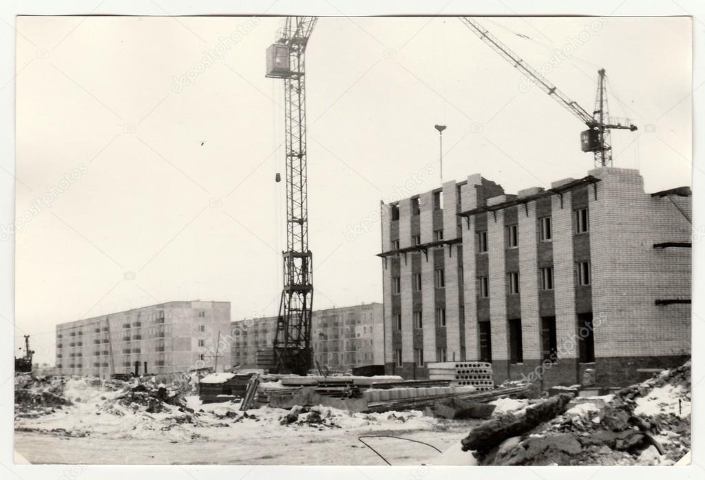 Vintage photo shows construction of blocks of flats in USSR. Winter time.