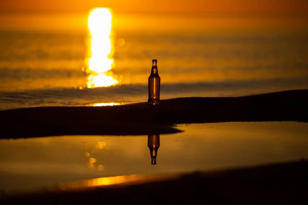 The sunset is reflected on the Beach of Masua, Iglesias