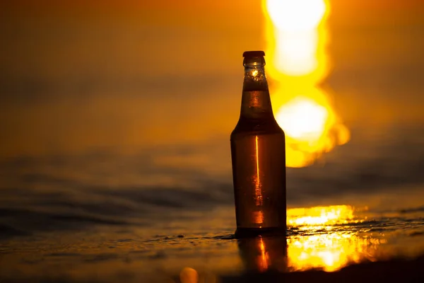 One Bottle Light Beer Beach Sunset Sea Shore Waves Bokeh — Stock Photo, Image