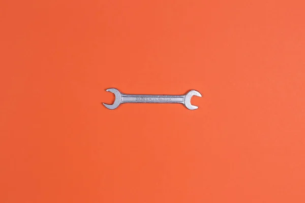 Wrench, on an orange background. garage, auto repair